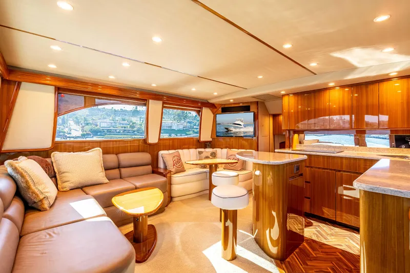 Chaser Yacht Photos Pics Luxurious interior of 2014 Viking 46 Convertible yacht with elegant wood finishes and plush seating.