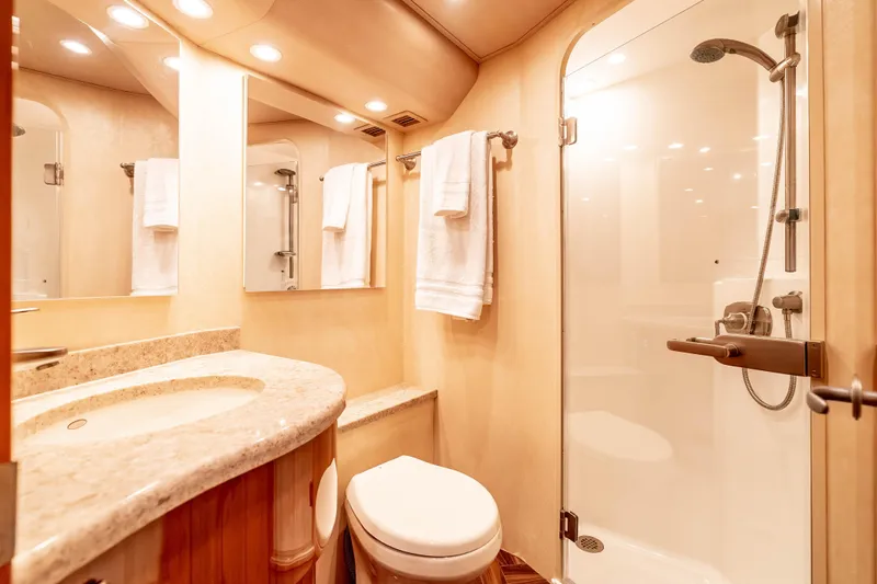 Chaser Yacht Photos Pics Luxurious bathroom in 2014 Viking 46 Convertible yacht with shower and elegant fixtures.