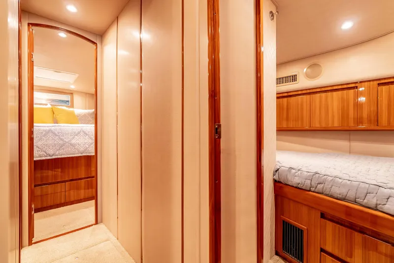 Chaser Yacht Photos Pics Luxurious interior of 2014 Viking 46 Convertible yacht with cozy bedrooms and elegant wood finishes.
