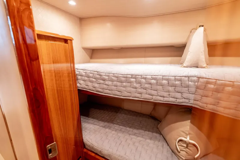 Chaser Yacht Photos Pics 2014 Viking 46 Convertible yacht interior with cozy bunk beds and wooden finishes.
