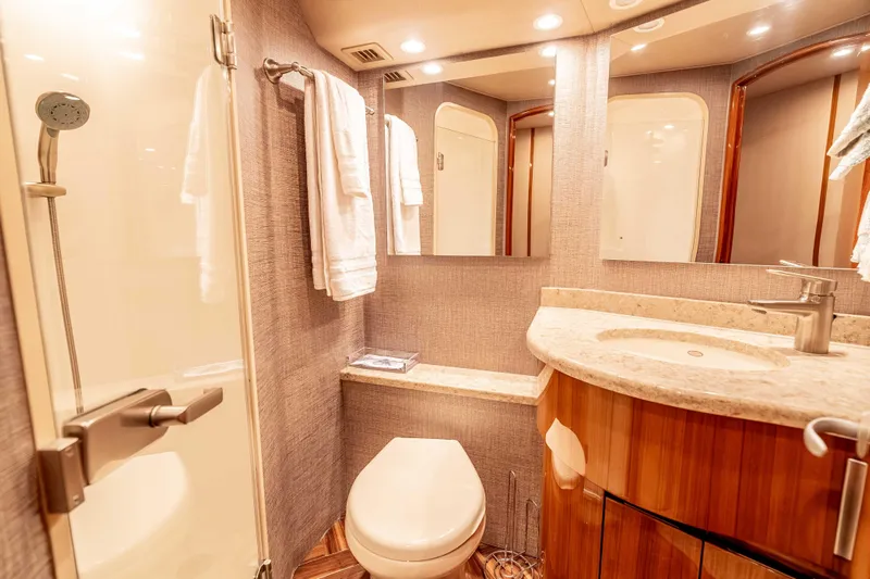 Chaser Yacht Photos Pics Luxurious bathroom in 2014 Viking 46 Convertible yacht with modern fixtures and elegant design.
