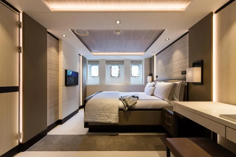Laurentia Yacht Photos Pics Luxurious bedroom interior of 2017 Heesen Fast Displacement Motor Yacht, featuring modern design and elegant lighting.