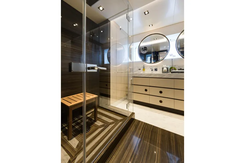 Laurentia Yacht Photos Pics Luxurious bathroom in 2017 Heesen Fast Displacement Motor Yacht with glass shower and modern fixtures.