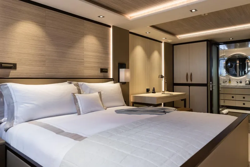 Laurentia Yacht Photos Pics Luxurious bedroom interior of 2017 Heesen Fast Displacement Motor Yacht, featuring elegant design and modern amenities.