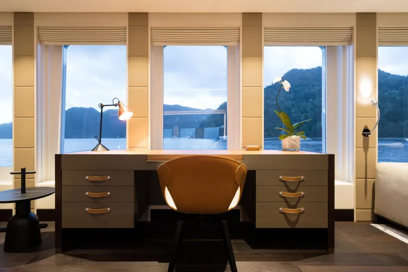 Laurentia Yacht Photos Pics Luxurious yacht interior with desk, chair, and scenic window views, Heesen 2017 model.