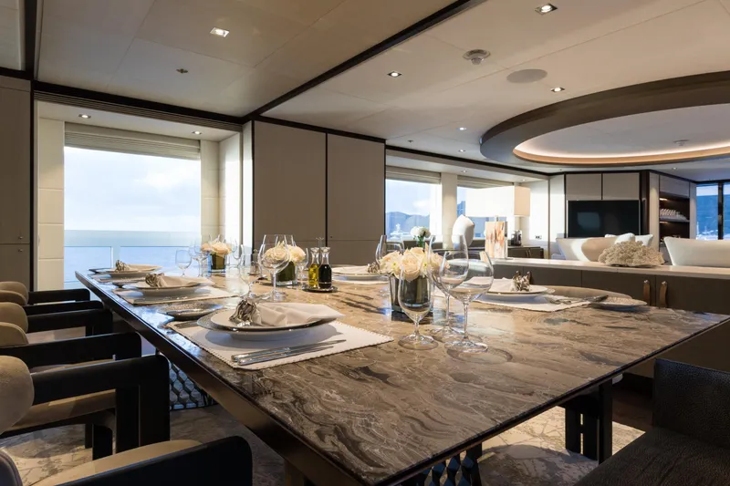 Laurentia Yacht Photos Pics Luxurious dining area on a 2017 Heesen Fast Displacement Motor Yacht, elegantly set table.