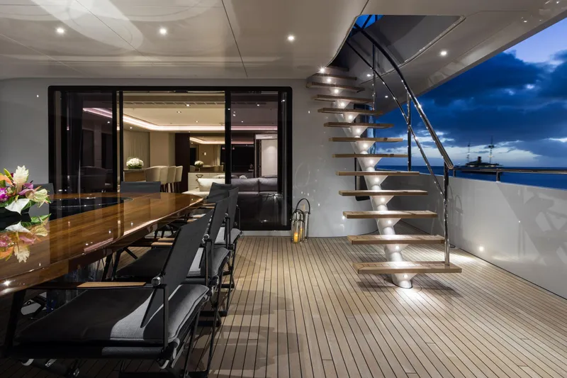 Laurentia Yacht Photos Pics Luxurious 2017 Heesen Fast Displacement Motor Yacht deck with elegant dining area and staircase.