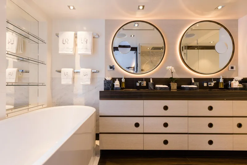 Laurentia Yacht Photos Pics Luxurious yacht bathroom with dual mirrors, elegant vanity, and modern fixtures on Heesen 2017 model.