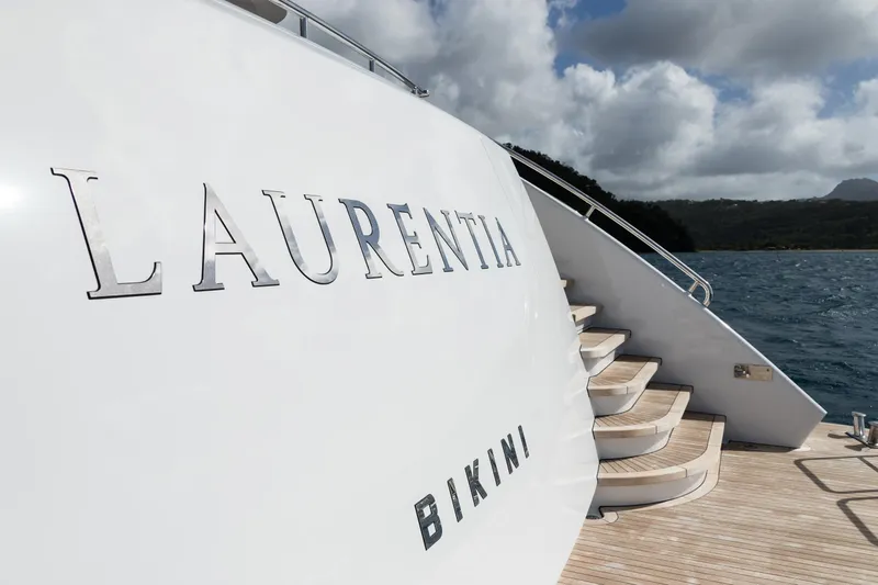Laurentia Yacht Photos Pics Heesen 2017 Fast Displacement Motor Yacht "Laurentia" with elegant deck stairs, ocean backdrop.