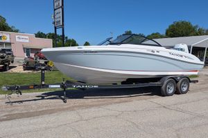 2022 Tahoe 210 S boat on trailer, parked outdoors near buildings.