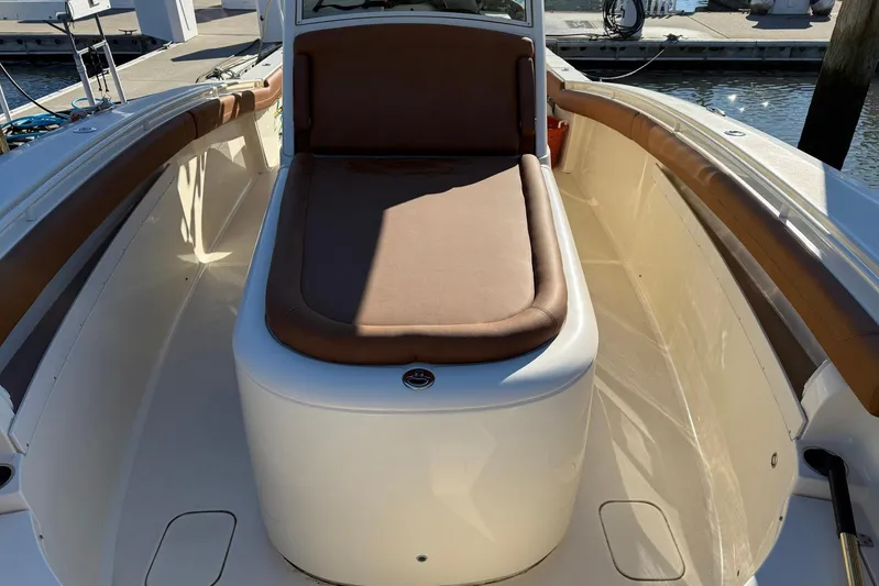 Electric Arc Yacht Photos Pics 2018 Scout 350 LXF boat interior with brown cushioned seating.