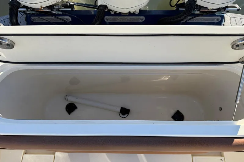 Electric Arc Yacht Photos Pics Open storage compartment on a 2018 Scout 350 LXF boat, showing interior space.