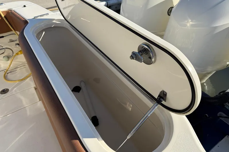 Electric Arc Yacht Photos Pics Open storage compartment on 2018 Scout 350 LXF boat, showcasing interior details.
