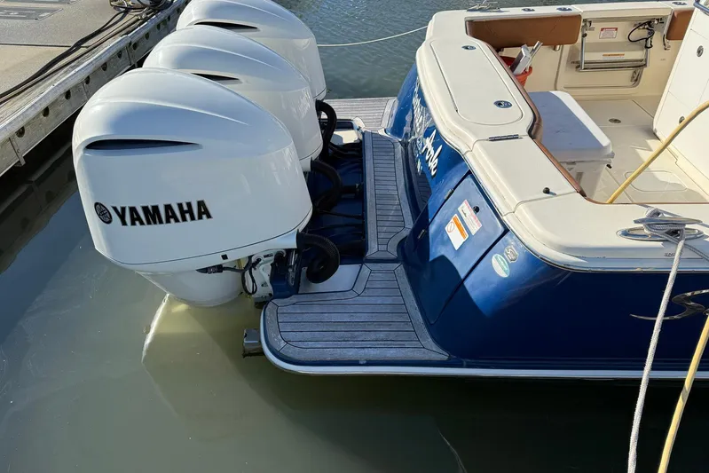 Electric Arc Yacht Photos Pics 2018 Scout 350 LXF boat with triple Yamaha outboard engines docked.
