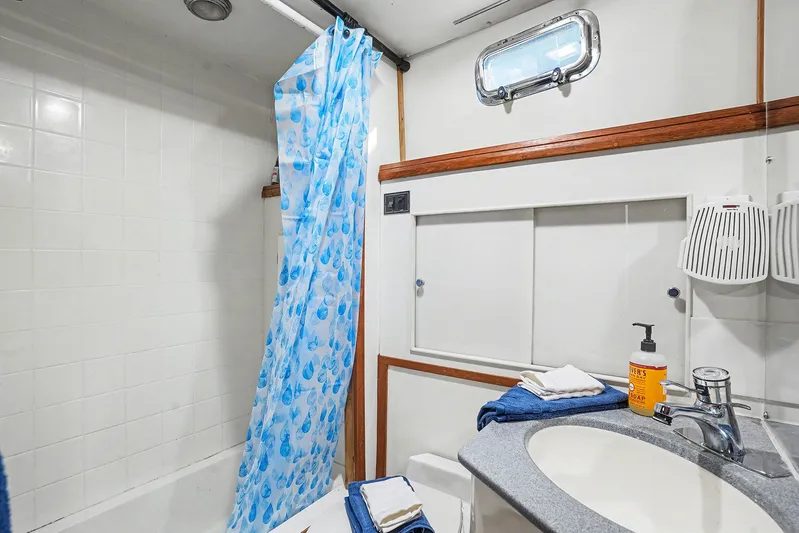 Gypsy Queen Yacht Photos Pics Bathroom on a 1991 Shannon VOYAGER boat with shower and sink.