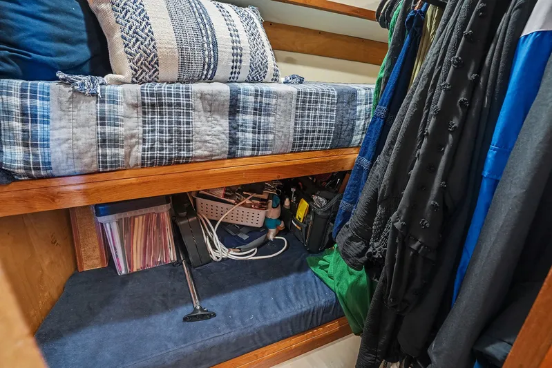 Gypsy Queen Yacht Photos Pics Interior of a 1991 Shannon VOYAGER with bed and storage.