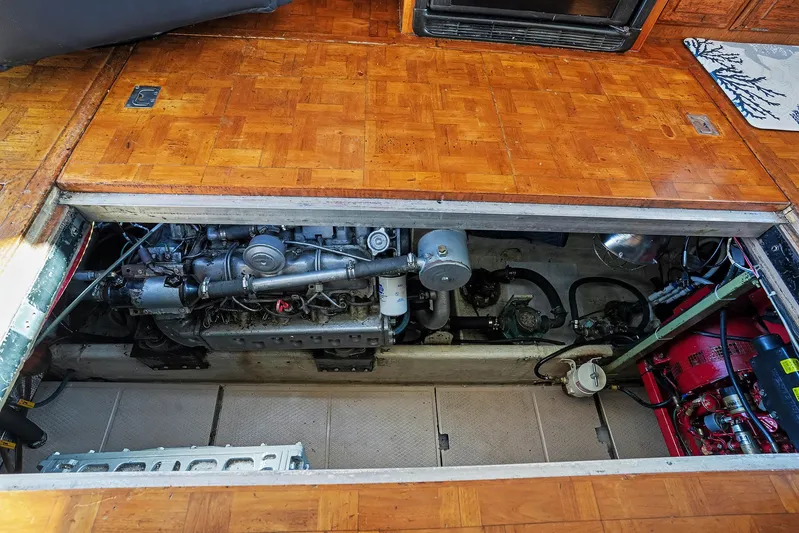 Gypsy Queen Yacht Photos Pics Engine compartment of a 1991 Shannon VOYAGER boat with wooden flooring.