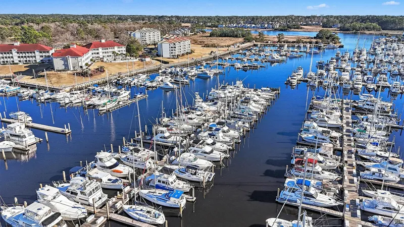 Gypsy Queen Yacht Photos Pics Aerial view of a bustling marina with numerous boats and buildings in the background.