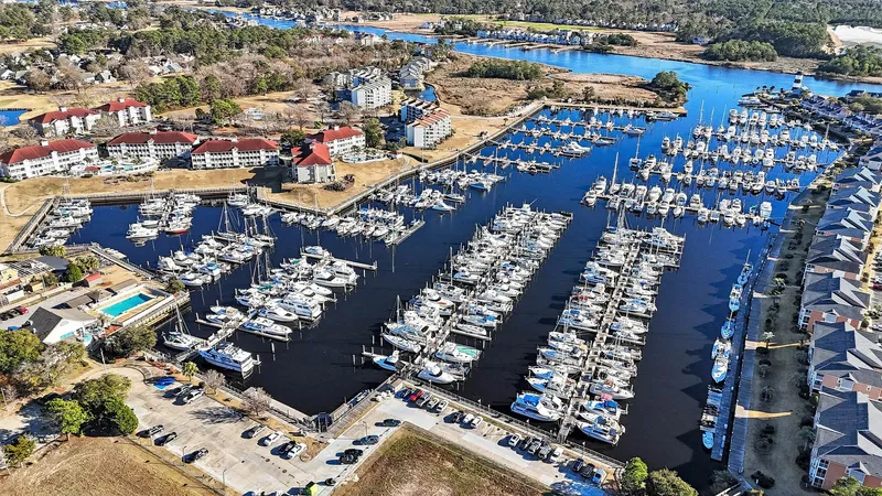 Gypsy Queen Yacht Photos Pics Aerial view of marina with numerous boats and surrounding buildings.