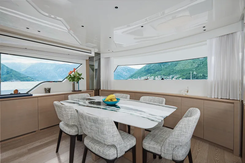 Zafiro III Yacht Photos Pics Luxurious dining area on 2020 Sanlorenzo SX88 yacht with scenic window views.