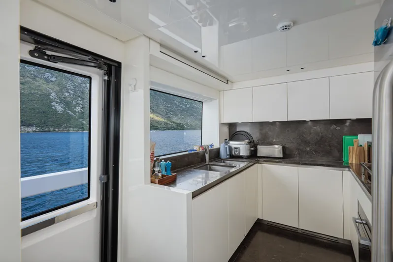 Zafiro III Yacht Photos Pics Modern kitchen interior on 2020 Sanlorenzo SX88 yacht with ocean view.