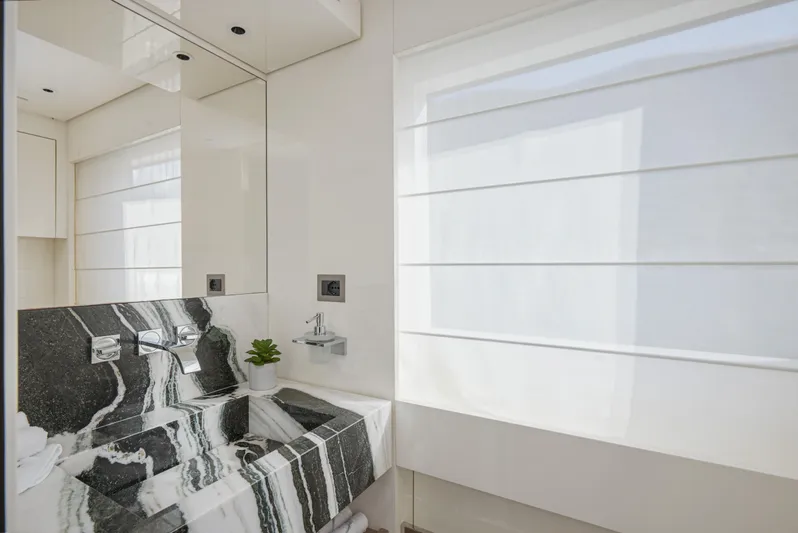 Zafiro III Yacht Photos Pics Luxurious bathroom in 2020 Sanlorenzo SX88 yacht with modern marble sink and sleek design.