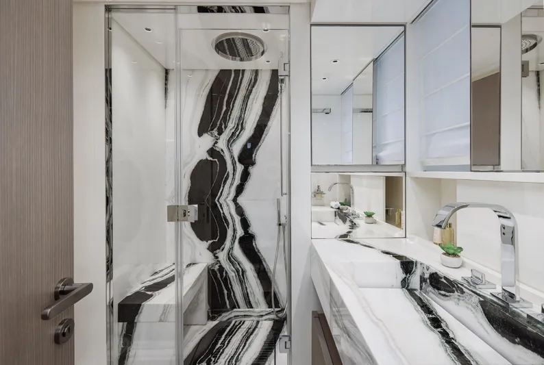 Zafiro III Yacht Photos Pics Luxurious bathroom in 2020 Sanlorenzo SX88 yacht with elegant black and white marble design.
