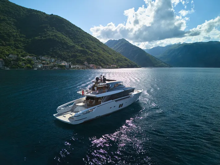Zafiro III Yacht Photos Pics Sanlorenzo SX88 yacht cruising in scenic waters, surrounded by lush mountains, 2020 model.