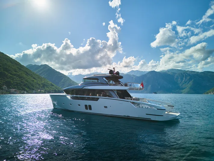 Zafiro III Yacht Photos Pics Sanlorenzo SX88 2020 yacht cruising on a scenic lake with mountainous backdrop.