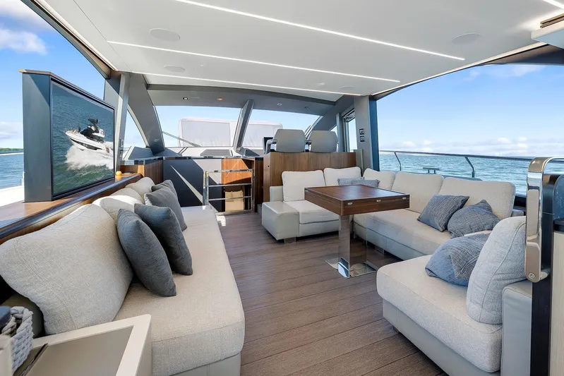 Ascendo Yacht Photos Pics Luxurious interior of 2022 Astondoa 66 yacht with modern seating and ocean view.