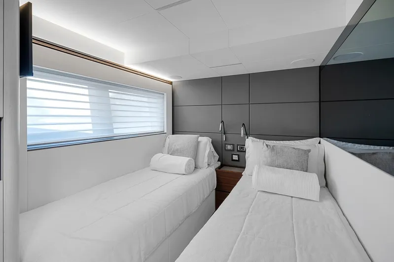 Ascendo Yacht Photos Pics Luxurious twin cabin in 2022 Astondoa 66 yacht, featuring modern design and comfortable bedding.