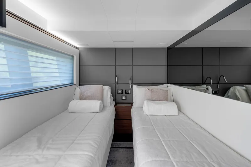 Ascendo Yacht Photos Pics Luxurious twin cabin in 2022 Astondoa 66 yacht with modern design and plush bedding.