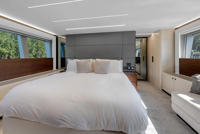 Ascendo Yacht Photos Pics Luxurious bedroom interior of 2022 Astondoa 66 yacht with modern design and large windows.
