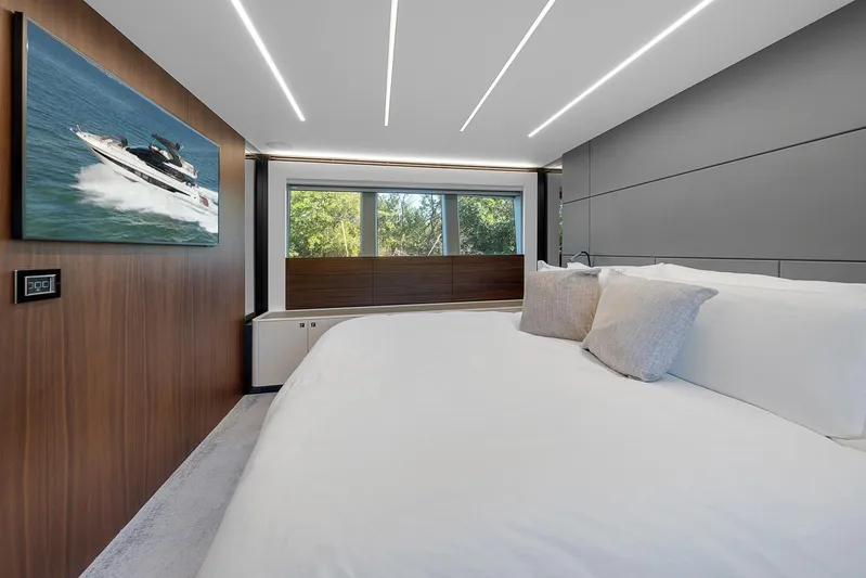 Ascendo Yacht Photos Pics Luxurious bedroom interior on 2022 Astondoa 66 yacht with modern design and large windows.