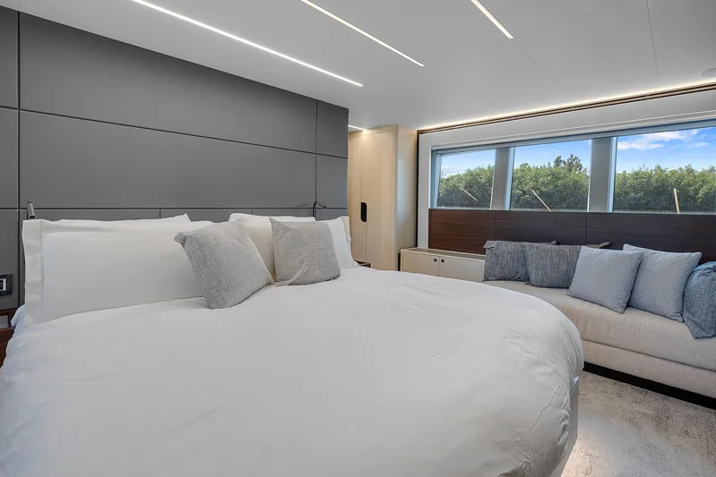 Ascendo Yacht Photos Pics Luxurious bedroom in 2022 Astondoa 66 yacht with modern design and large windows.