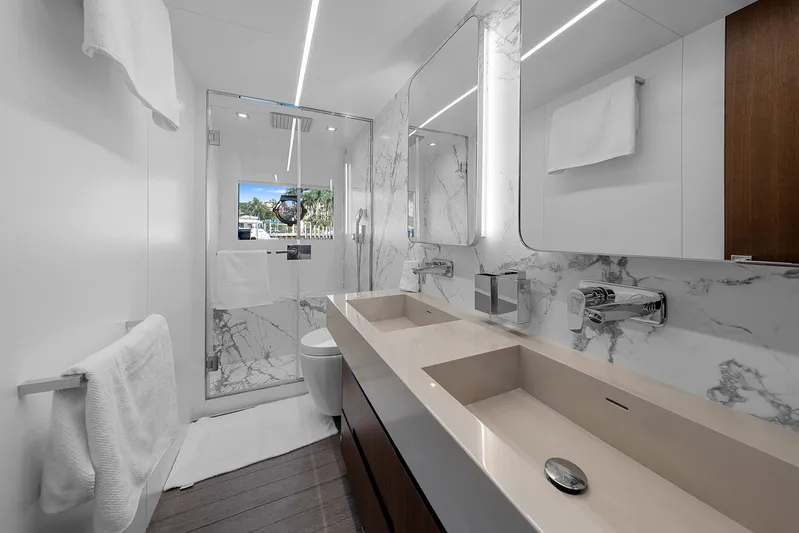 Ascendo Yacht Photos Pics Luxurious bathroom in 2022 Astondoa 66 yacht with marble accents and modern fixtures.