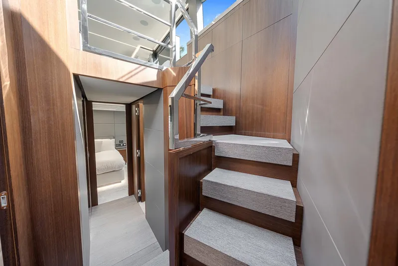 Ascendo Yacht Photos Pics Interior of 2022 Astondoa 66 yacht with modern staircase and cabin view.