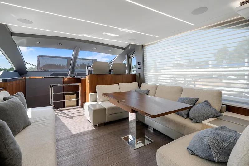 Ascendo Yacht Photos Pics Luxurious interior of 2022 Astondoa 66 yacht with modern seating and dining area.