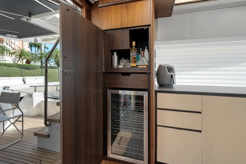 Ascendo Yacht Photos Pics Astondoa 66 yacht interior with minibar and modern cabinetry, 2022 model.