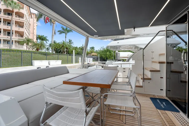 Ascendo Yacht Photos Pics Astondoa 66 yacht 2022, elegant outdoor seating and dining area with modern design.