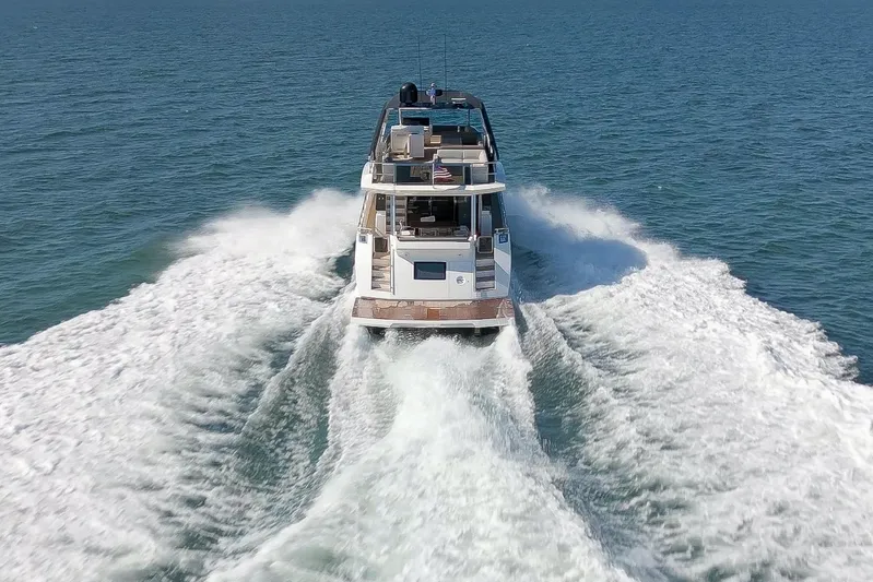 Ascendo Yacht Photos Pics Astondoa 66 yacht cruising on open water, 2022 model.