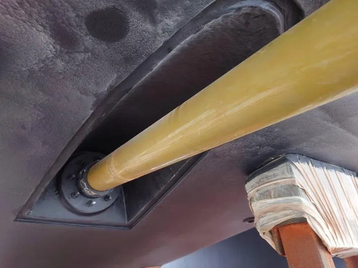 Hideout Yacht Photos Pics Close-up of Horizon PC65 2022 boat's propeller shaft installation.