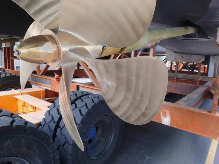 Hideout Yacht Photos Pics Close-up of a 2022 Horizon PC65 yacht propeller on a trailer.