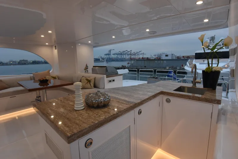 Hideout Yacht Photos Pics Luxurious Horizon PC65 yacht interior with elegant decor and waterfront view, 2022 model.