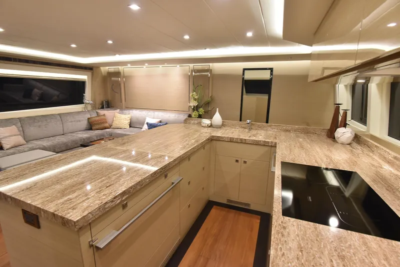 Hideout Yacht Photos Pics Luxurious yacht interior with modern kitchen and cozy seating, Horizon PC65, 2022 model.