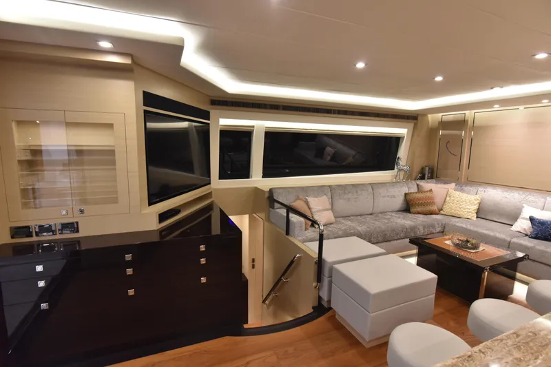 Hideout Yacht Photos Pics Luxurious interior of 2022 Horizon PC65 yacht with modern seating and elegant lighting.