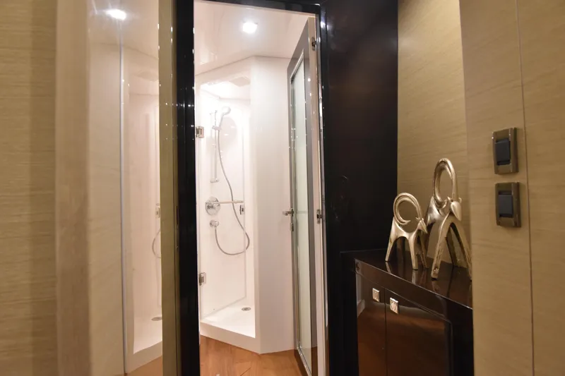 Hideout Yacht Photos Pics Luxurious bathroom interior on Horizon PC65 yacht, featuring modern shower and elegant decor, 2022 model.