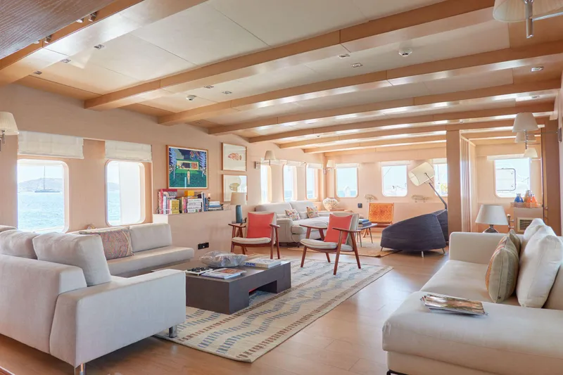 Hayama Yacht Photos Pics Luxurious yacht interior with modern furnishings, spacious seating, and large windows, built by Hakodate Shipyard in 1988.