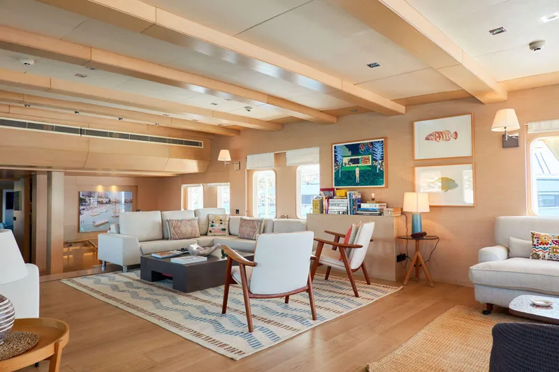 Hayama Yacht Photos Pics Luxurious yacht interior with modern decor, wooden accents, and comfortable seating, built by Hakodate Shipyard in 1988.