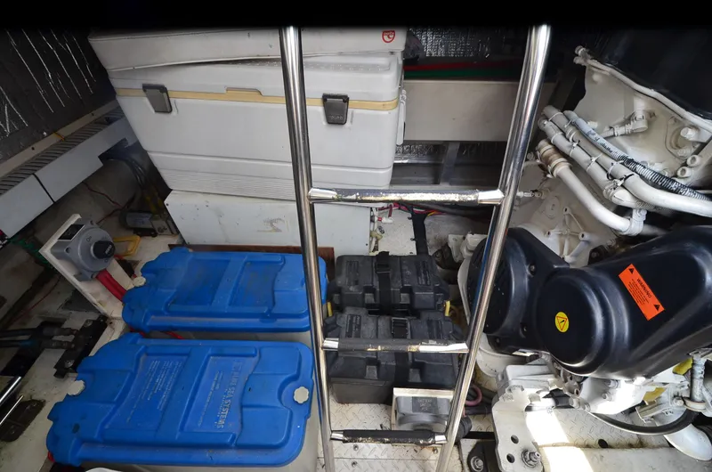Tenacious Yacht Photos Pics Engine room of 2003 Cruisers Yachts 5000 Sedan Sport with batteries and equipment.